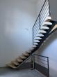 escalier métallique tournant limon central débillardé marche bois