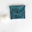 Pochette à savon en coton enduit imperméable. Se lave d'un simple coup d'éponge.
