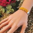 Bracelet jonc en acier inoxydable et dentelle de soie française ocre brodée