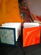 Carnets en accordéon 10 x 10 - 12 vues recto-verso - papier recyclé 220 g/m2 permettant l'aquarelle - couvertures variées papier marbré, ou népalais, toile ou simili cuir.